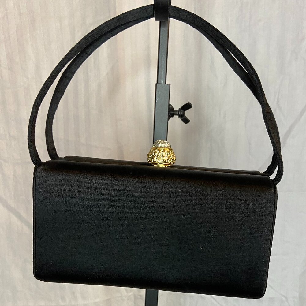 Black hand purse with gemstone clasp